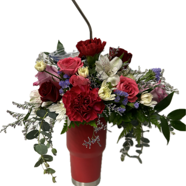Mixed bouquet in a red tumbler with a straw