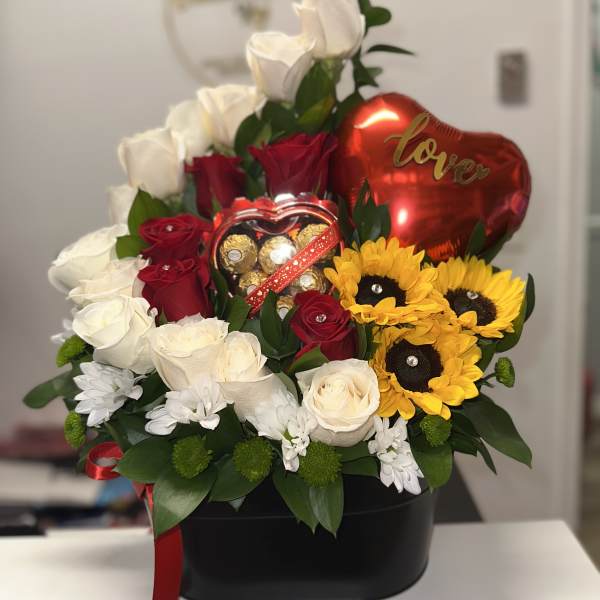 Bouquet of red and white roses with sunflowers and a heart balloon