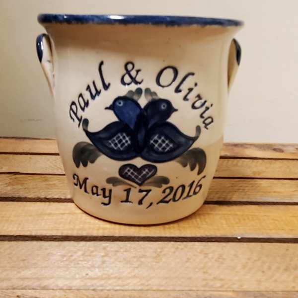 Ceramic planter with blue bird design and the names Paul & Olivia