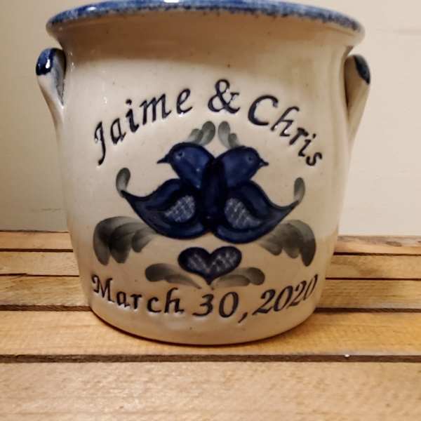 Ceramic pot with blue bird design and the names Jaime & Chris
