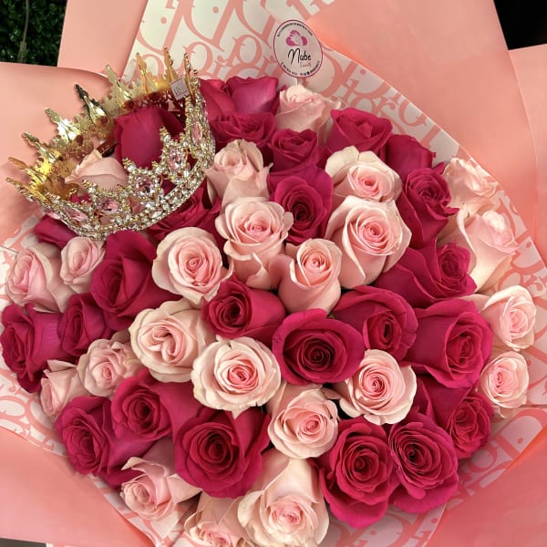 Bouquet of pink and hot pink roses with a jeweled crown