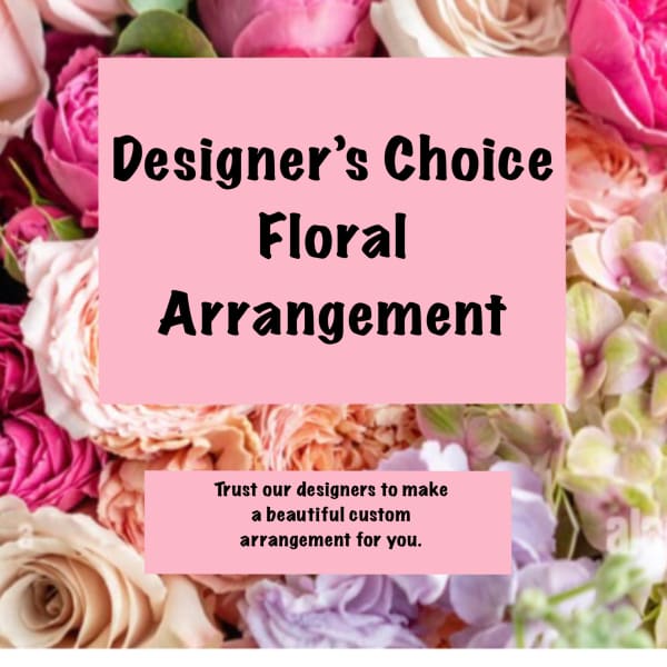 Pink and cream roses with a designer's choice floral arrangement sign