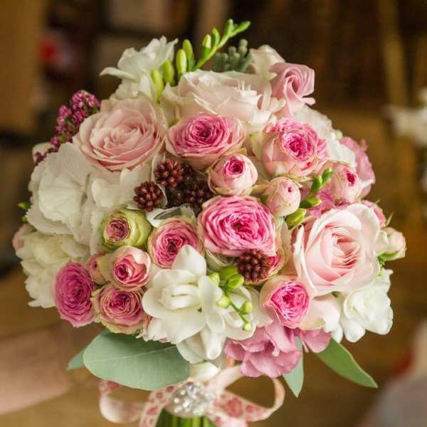 Pink and white rose bouquet with ribbon wrap