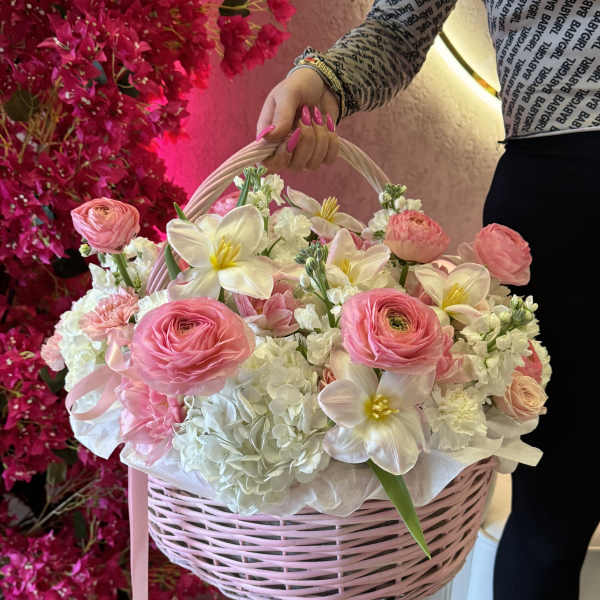Pink and white flower basket with a ribbon handle