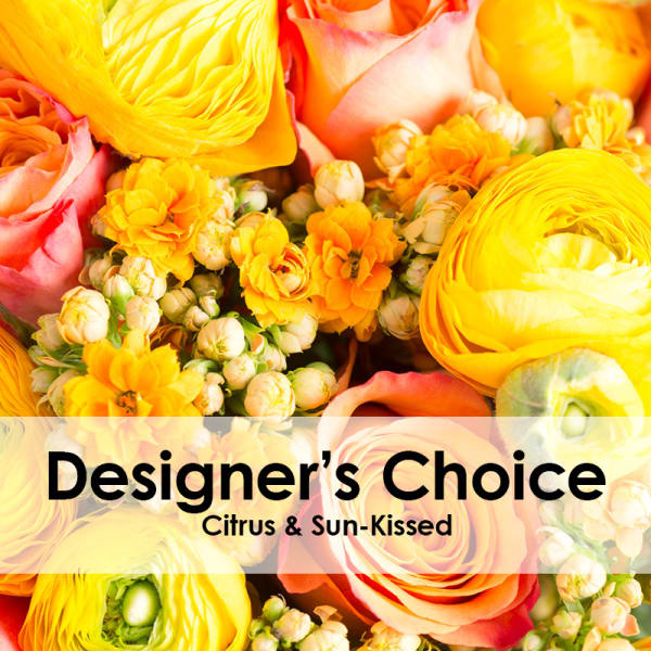 Citrus-toned bouquet with yellow ranunculus and pink roses