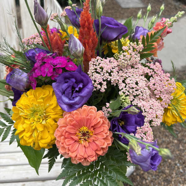 Colorful bouquet with purple, yellow, and coral flowers