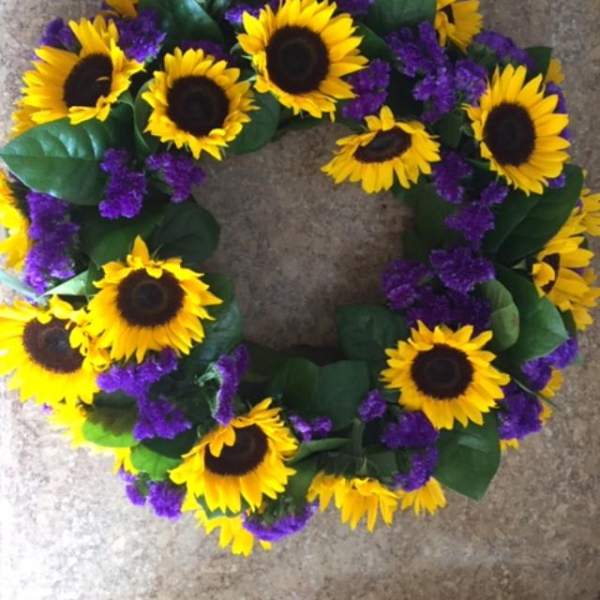 Sunflower wreath with purple filler flowers