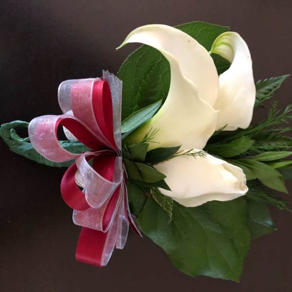 White calla lily bouquet with red and silver ribbon
