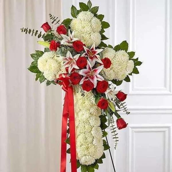 Standing floral spray with red roses, white lilies, and white mums
