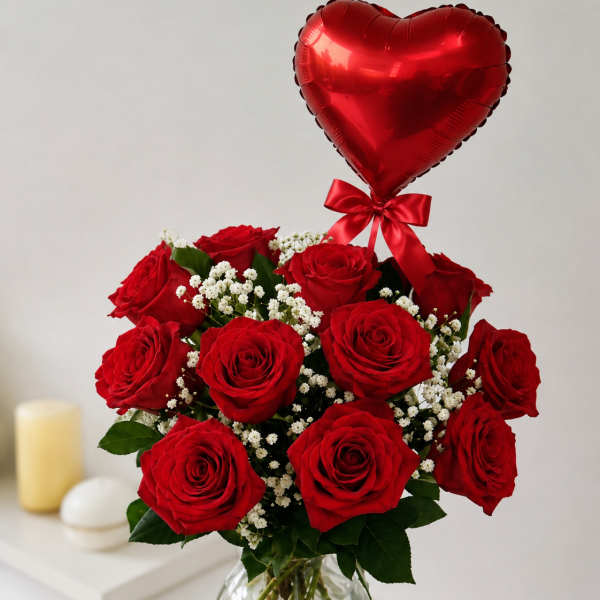 Red roses in a glass vase with a red heart balloon