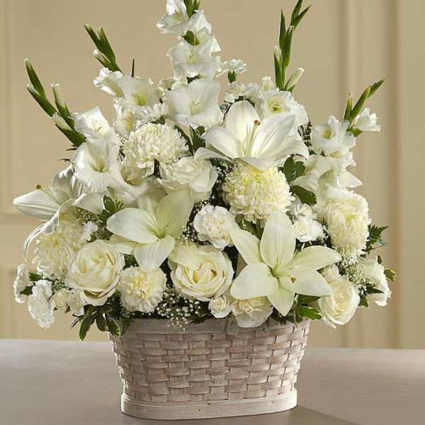 White floral arrangement in a woven basket