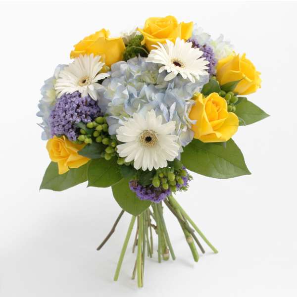 Bouquet of yellow roses, white gerbera daisies, and blue hydrangea