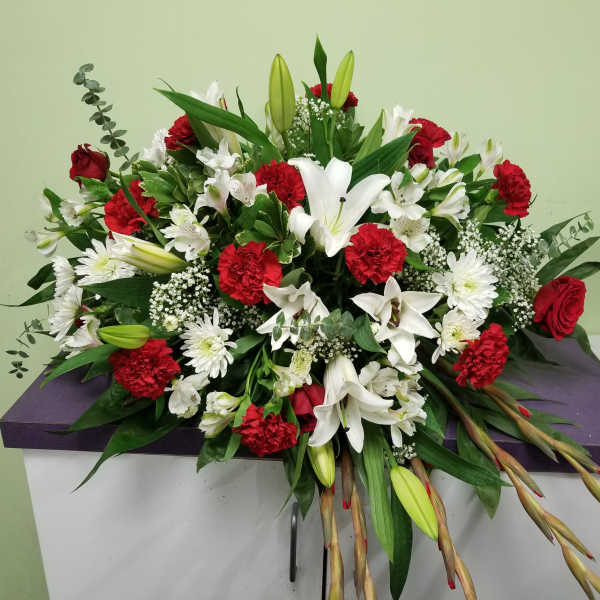 Large red and white floral spray with lilies and carnations