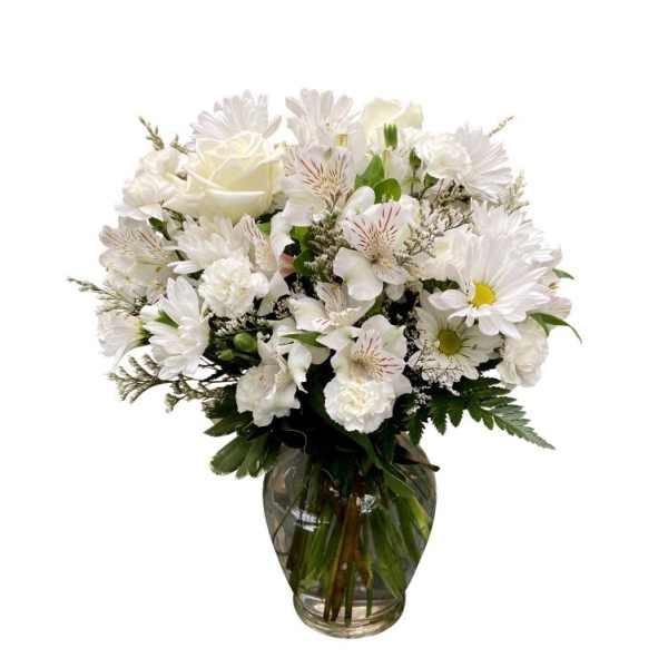 White mixed bouquet in a clear glass vase