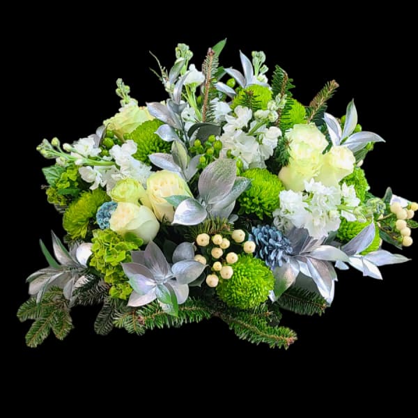 Green and white floral arrangement with silver foliage and berries