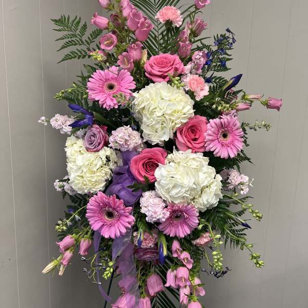Pink and white floral standing spray with roses and gerbera daisies