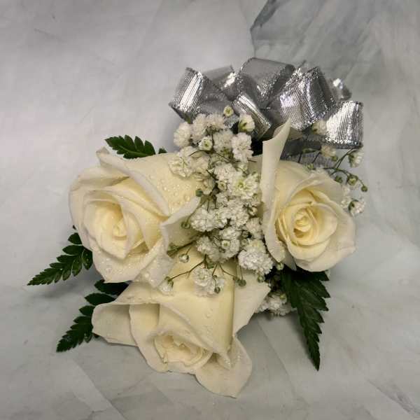 Cream roses with baby's breath and a silver bow