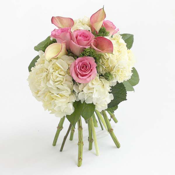 Bouquet of pink roses, white hydrangeas, and calla lilies