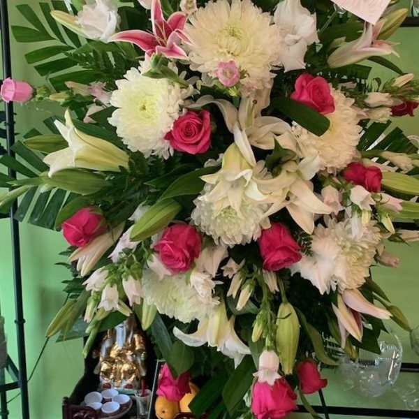 Large bouquet of pink roses, white lilies, and white chrysanthemums