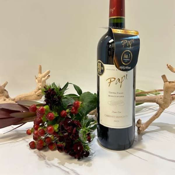 Wine bottle with a small red berry floral accent