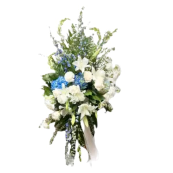 Tall white and blue floral spray with ribbon