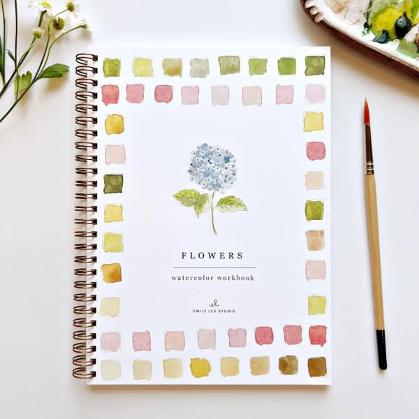 Watercolor flower workbook with a painted hydrangea on the cover
