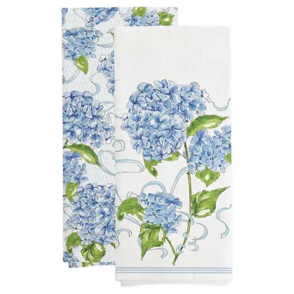 Two white napkins with blue hydrangea prints and green leaves