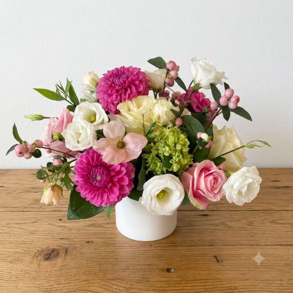 Pink and white mixed bouquet in a white vase