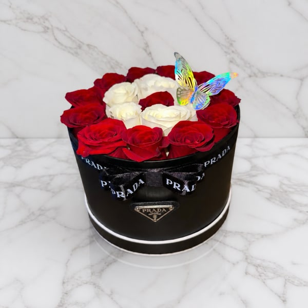 ELEGANT SMALL PRADA BOX, WITH WHITE ROSES, RED ROSES; A GOLDEN ROSE IN THE MIDDLE