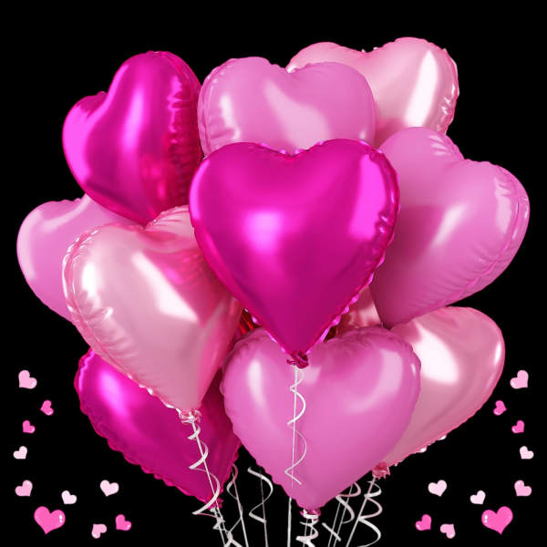 Cluster of pink heart-shaped balloons on a black background