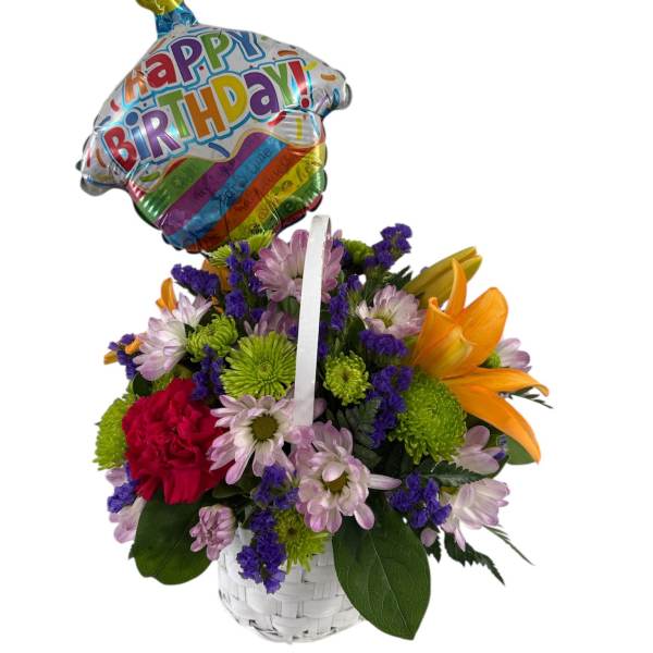 Birthday flower basket with a balloon and mixed blooms in a white basket