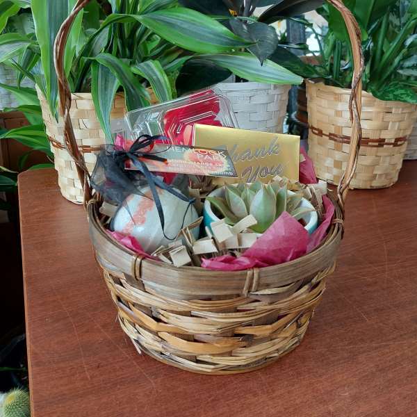 Gift basket with a succulent, bath items, and a thank-you card