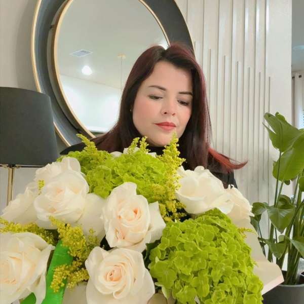 White roses and green hydrangeas in a box bouquet