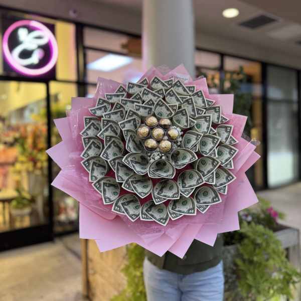 Money bouquet wrapped in pink paper with Ferrero Rocher chocolates