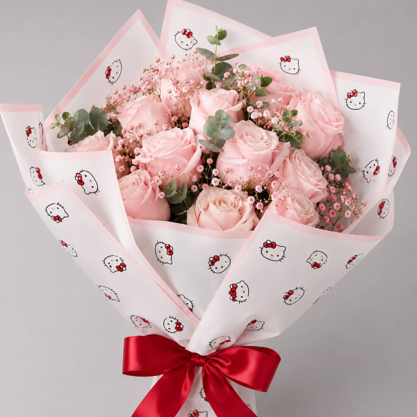 Pink rose bouquet wrapped in Hello Kitty paper with a red ribbon