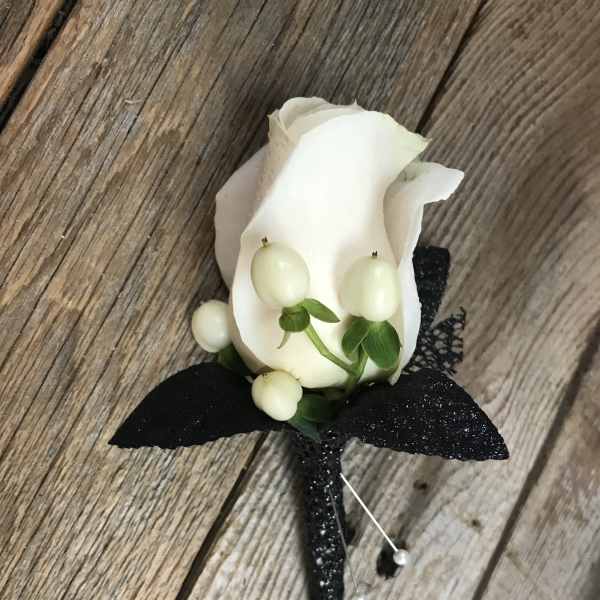 White rose boutonniere with black ribbon and pearl pins