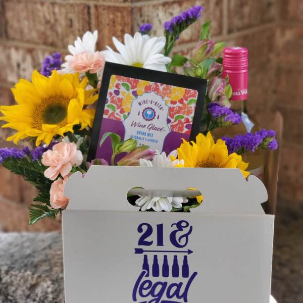 Flower gift box with sunflowers, daisies, carnations, and a wine mix packet