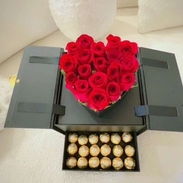 Heart-shaped red rose box with a tray of Ferrero Rocher chocolates