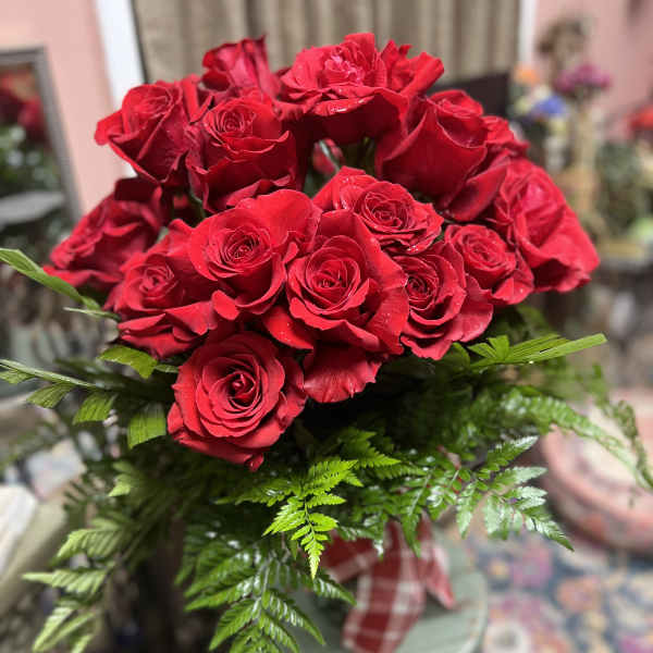 Bouquet of red roses with fern foliage