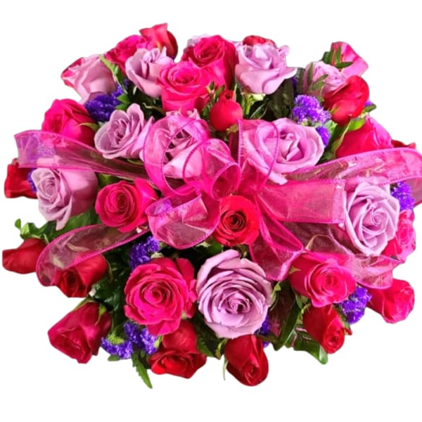 Bouquet of pink and red roses with a pink ribbon bow