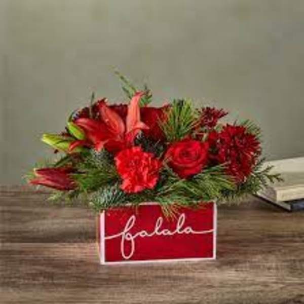Red floral arrangement in a red box with white script