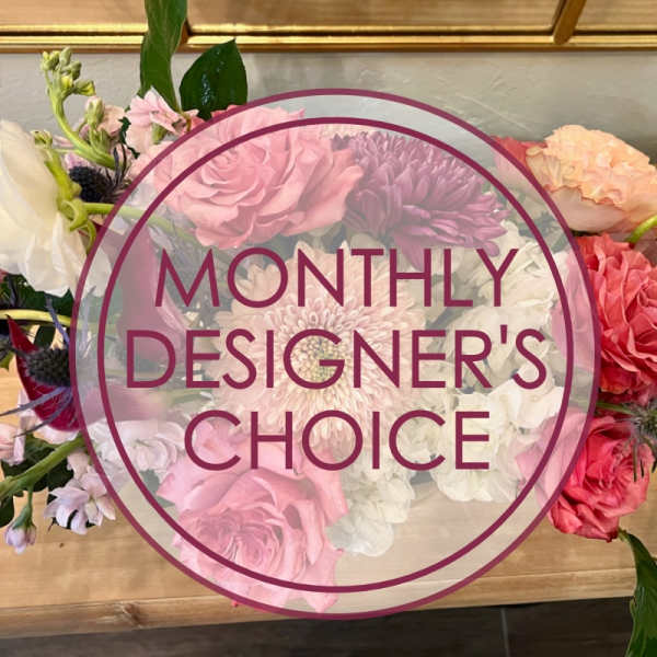 Mixed bouquet of pink, white, and purple flowers with a designer's choice label
