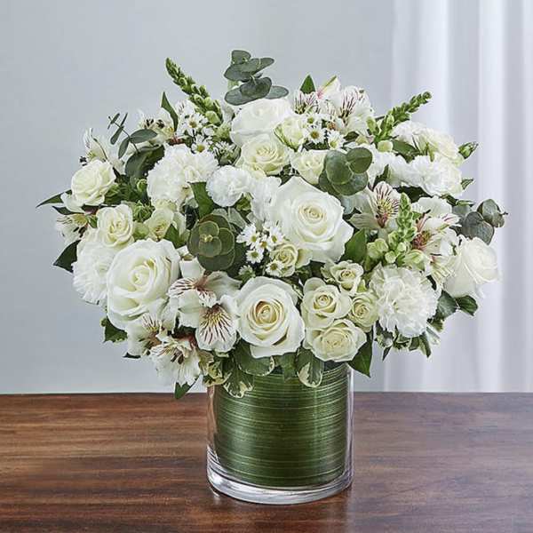 White rose bouquet in a clear glass vase