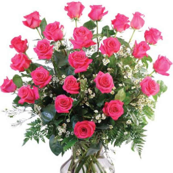 Pink roses arranged in a clear glass vase