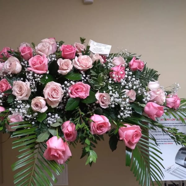 Large pink rose spray with baby's breath and greenery
