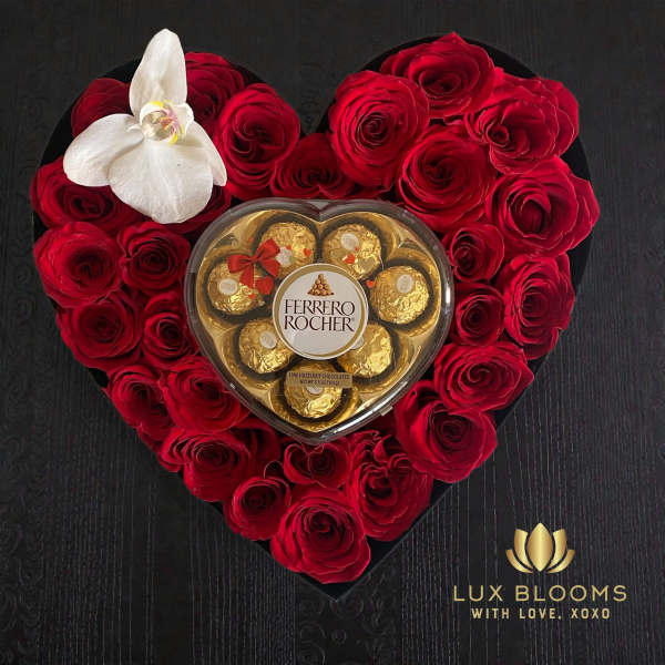 Heart-shaped rose arrangement with a Ferrero Rocher box and white orchid