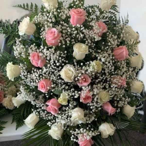 Large bouquet of pink and white roses with baby's breath