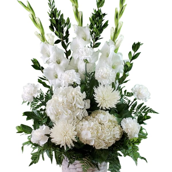 White floral arrangement with gladiolus, hydrangeas, carnations, and mums in a basket