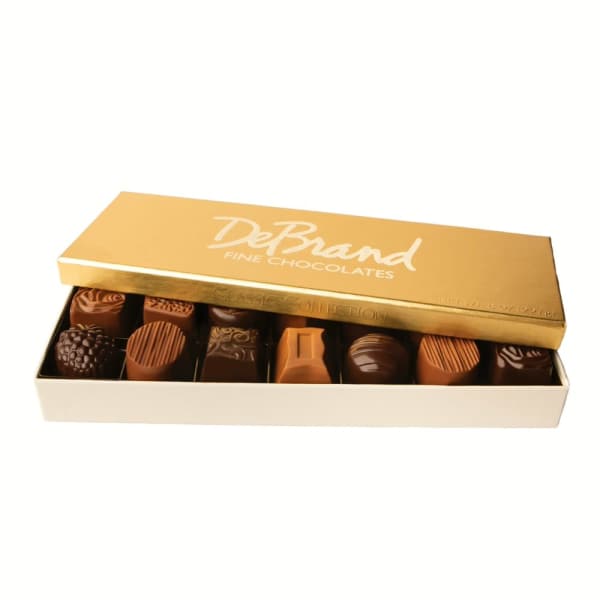 Box of assorted chocolates with a gold lid