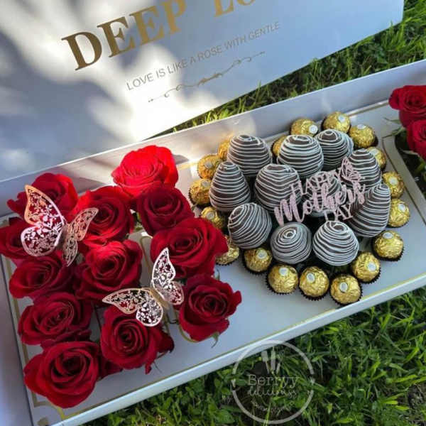 Red roses and chocolate truffles arranged in a gift box